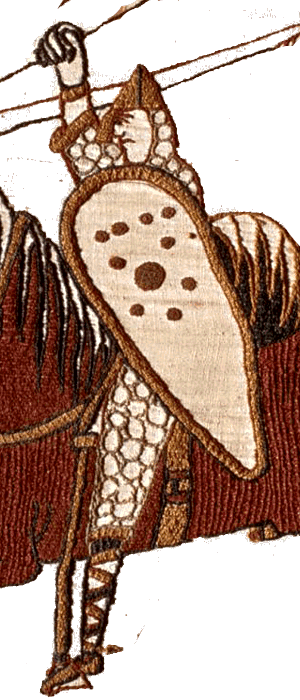 Der Teppich von Bayeux ist eine in der zweiten Hälfte des 11. Jahrhunderts entstandene Stickarbeit. Erzeigt in Bild und Text auf 68 Metern in 58 Einzelszenen die dargestellte Eroberung Englands durch den Normannenherzog Wilhelm den Eroberer